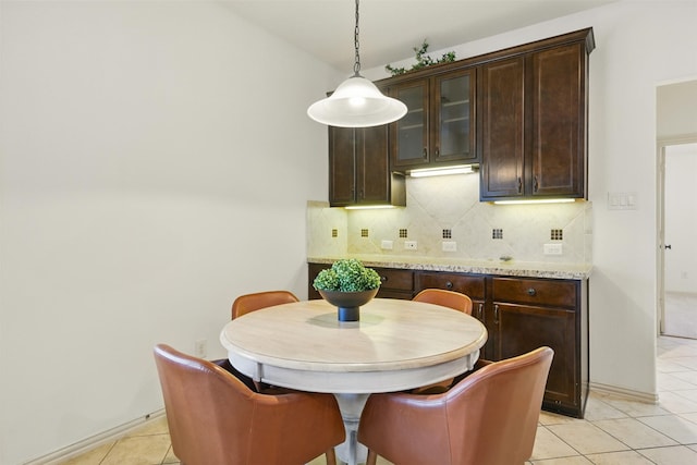 19014 Ridge Cove Ln, Cypress, TX 77433 - dining area featuring light tile patterned floors and baseboards