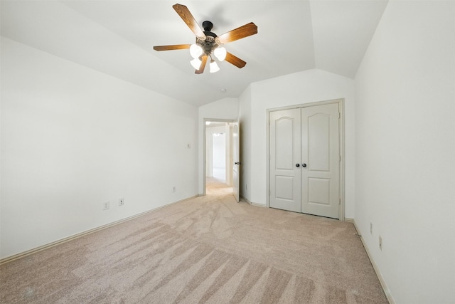 19014 Ridge Cove Ln, Cypress, TX 77433 - unfurnished bedroom with light colored carpet, lofted ceiling, a closet, and ceiling fan