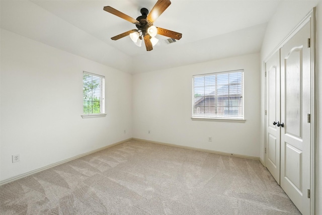 19014 Ridge Cove Ln, Cypress, TX 77433 - unfurnished bedroom with light carpet, baseboards, vaulted ceiling, and a ceiling fan
