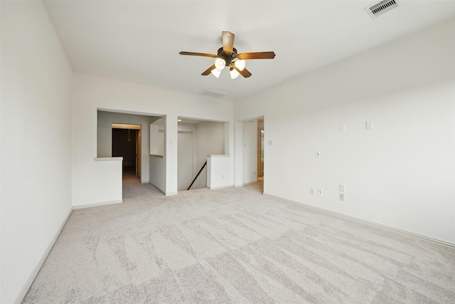 19014 Ridge Cove Ln, Cypress, TX 77433 - spare room featuring a ceiling fan, light carpet, and baseboards
