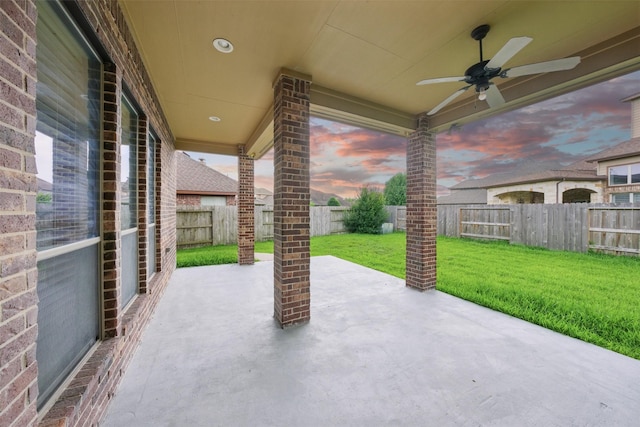 19014 Ridge Cove Ln, Cypress, TX 77433 - patio terrace at dusk with ceiling fan and a patio