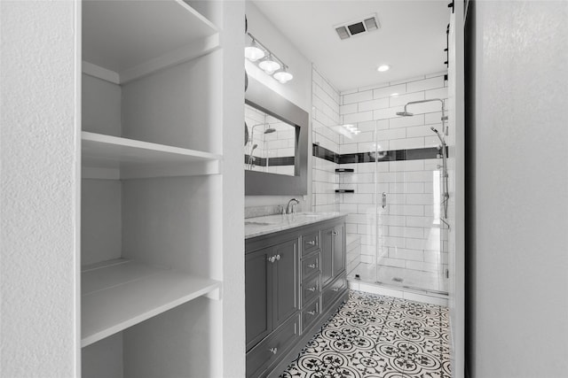 18809 Egret Bay Blvd Unit 114, Webster, TX 77058 - full bath with a shower stall, vanity, tile patterned flooring, and recessed lighting