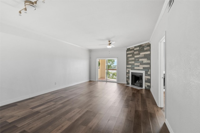 18809 Egret Bay Blvd Unit 114, Webster, TX 77058 - unfurnished living room featuring ornamental molding, ceiling fan, dark wood-style flooring, a tile fireplace, and baseboards