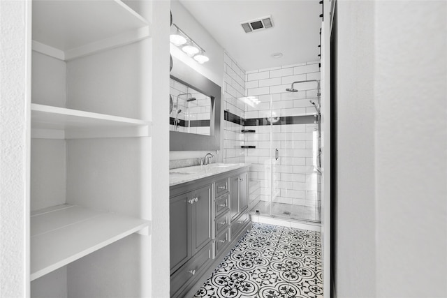 18809 Egret Bay Blvd Unit 114, Webster, TX 77058 - full bathroom with a stall shower, vanity, and tile patterned floors