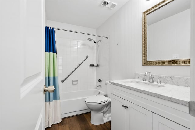 18809 Egret Bay Blvd Unit 114, Webster, TX 77058 - full bath featuring shower / bath combo with shower curtain, vanity, wood finished floors, and toilet