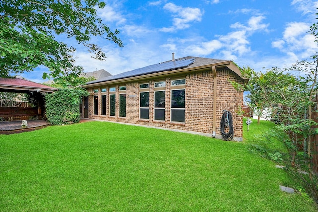 13422 Vintage Trail Ln, Pearland, TX 77584 - back of house with solar panels, a gazebo, brick siding, and a lawn