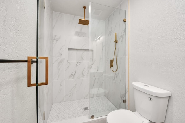 4439 Kacee Dr, Houston, TX 77084 - bathroom featuring a marble finish shower and a textured wall