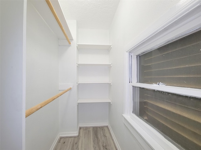 5703 Fraser Ave, Galveston, TX 77551 - spacious closet featuring wood finished floors