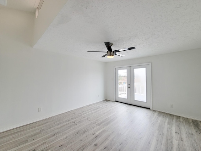 5703 Fraser Ave, Galveston, TX 77551 - unfurnished room with french doors, light wood-type flooring, ceiling fan, baseboards, and a textured ceiling