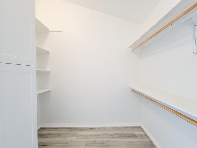 5703 Fraser Ave, Galveston, TX 77551 - spacious closet featuring light wood-type flooring