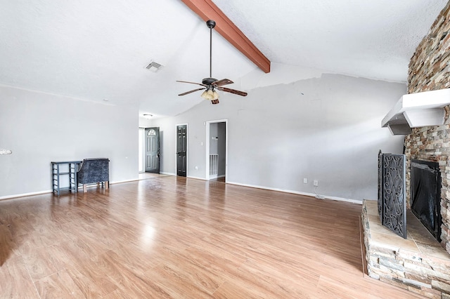 3106 Pilgrims Point Ln, Pearland, TX 77581 - unfurnished living room with a stone fireplace, ceiling fan, light wood-style flooring, and baseboards