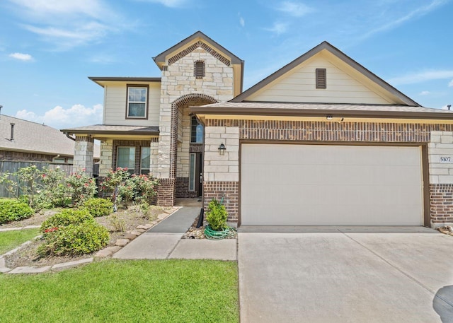 5107 Twin Summit Dr, Rosenberg, TX 77469 - view of front facade featuring brick siding, an attached garage, driveway, and stone siding