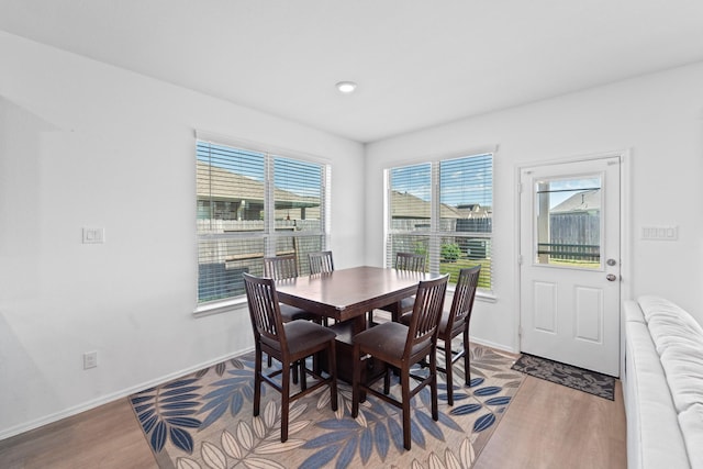 5107 Twin Summit Dr, Rosenberg, TX 77469 - dining room with wood finished floors, baseboards, and recessed lighting