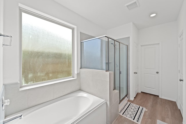 5107 Twin Summit Dr, Rosenberg, TX 77469 - full bath featuring a bath, a stall shower, and wood finished floors