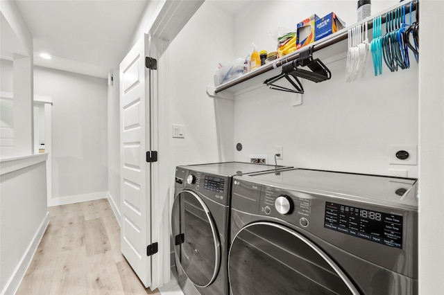 2105 Sam Wilson St Unit A, Houston, TX 77020 - laundry area with washer and clothes dryer, light wood finished floors, baseboards, and recessed lighting