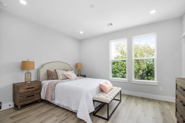 2105 Sam Wilson St Unit A, Houston, TX 77020 - bedroom featuring light wood finished floors, baseboards, and recessed lighting