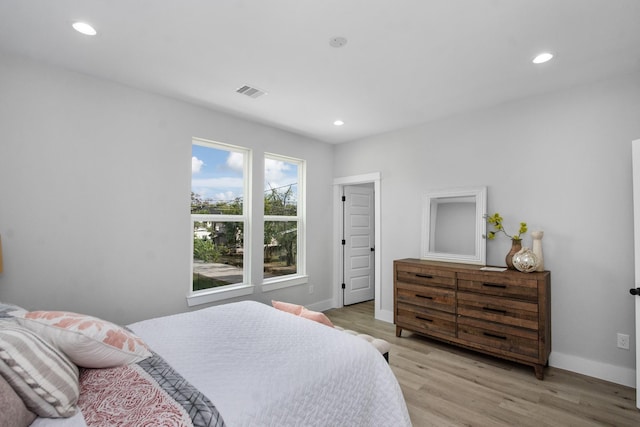 2105 Sam Wilson St Unit A, Houston, TX 77020 - bedroom with light wood-style flooring, recessed lighting, and baseboards