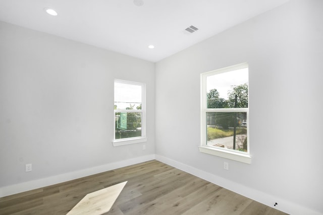 2105 Sam Wilson St Unit A, Houston, TX 77020 - empty room with wood finished floors, recessed lighting, and baseboards