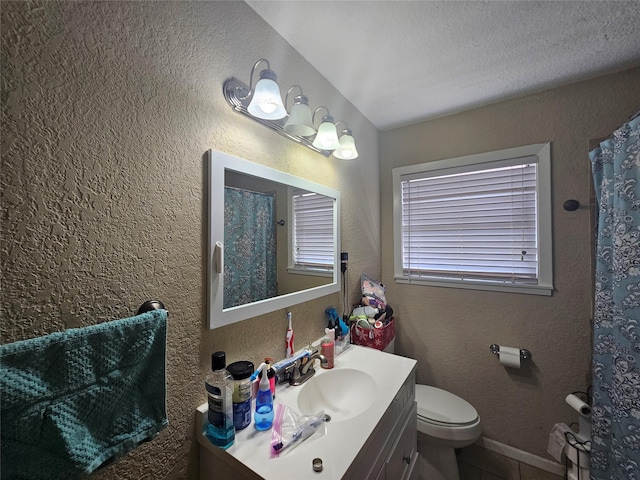 213 Linda St, Deer Park, TX 77536 - full bathroom featuring vanity, toilet, a textured wall, a shower with curtain, and tile patterned floors