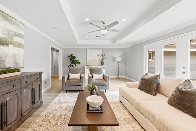 3619 N Braeswood Blvd, Houston, TX 77025 - living area with light wood finished floors, ceiling fan, a tray ceiling, crown molding, and recessed lighting