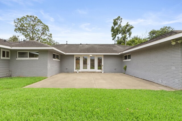 3619 N Braeswood Blvd, Houston, TX 77025 - rear view of house with french doors, a patio area, brick siding, a yard, and roof with shingles