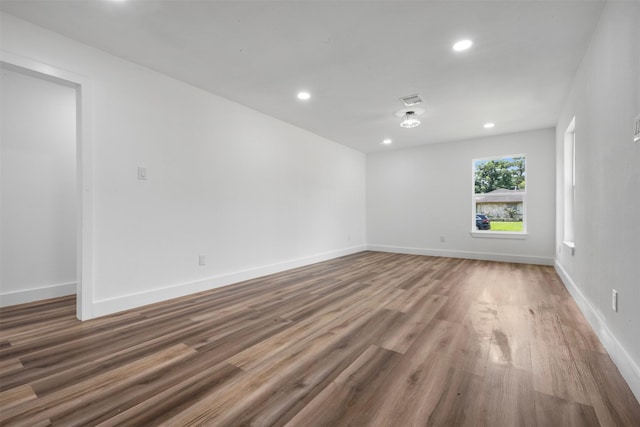 6155 Ridgeway Dr, Houston, TX 77033 - empty room featuring wood finished floors and recessed lighting