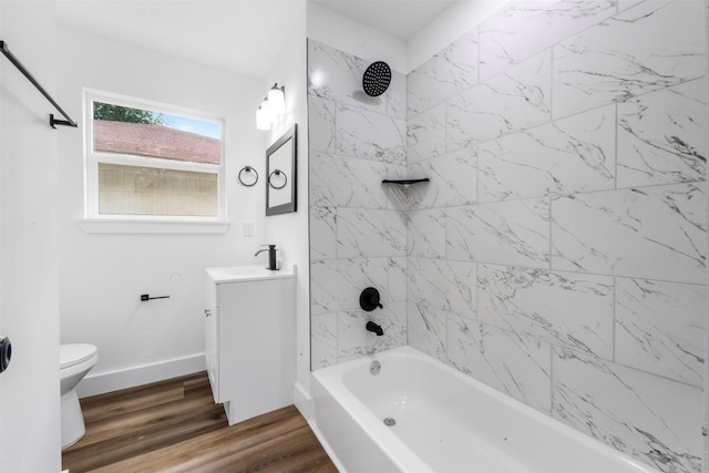 6155 Ridgeway Dr, Houston, TX 77033 - bathroom with vanity, shower / washtub combination, and wood finished floors