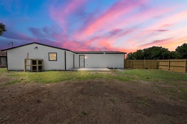 6155 Ridgeway Dr, Houston, TX 77033 - back of house at dusk with a patio