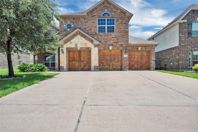 25402 Lancaster Pine Dr, Spring, TX 77389 - view of front of home with brick siding, driveway, and roof with shingles