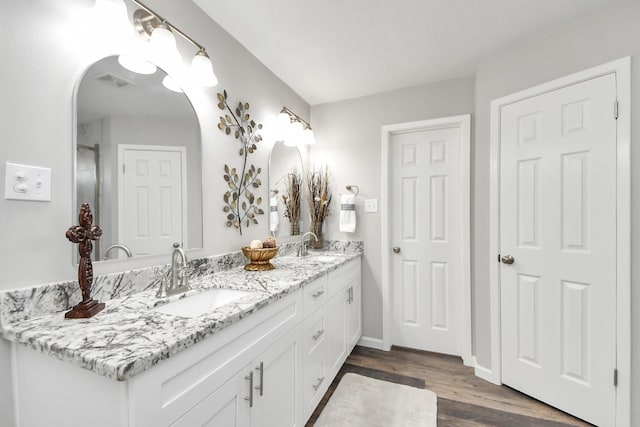 15723 Cascade Point Dr, Houston, TX 77084 - full bath featuring double vanity, wood finished floors, and baseboards