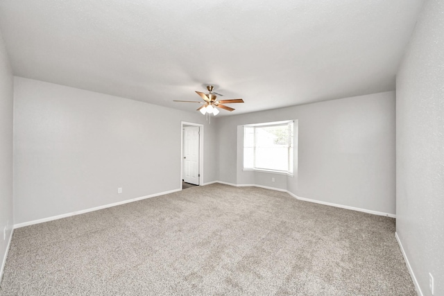 15723 Cascade Point Dr, Houston, TX 77084 - carpeted empty room featuring a ceiling fan and baseboards