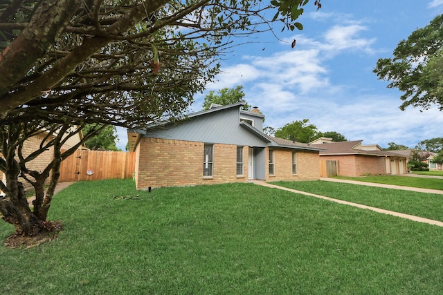 15723 Cascade Point Dr, Houston, TX 77084 - mid-century modern home featuring brick siding and a chimney