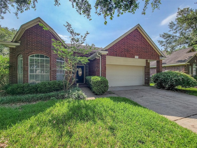 218 Windrift Ct, Sugar Land, TX 77479 - view of front of house with brick siding, a garage, driveway, and a front lawn