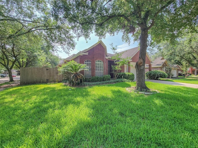 218 Windrift Ct, Sugar Land, TX 77479 - view of front of property featuring brick siding, a garage, and driveway