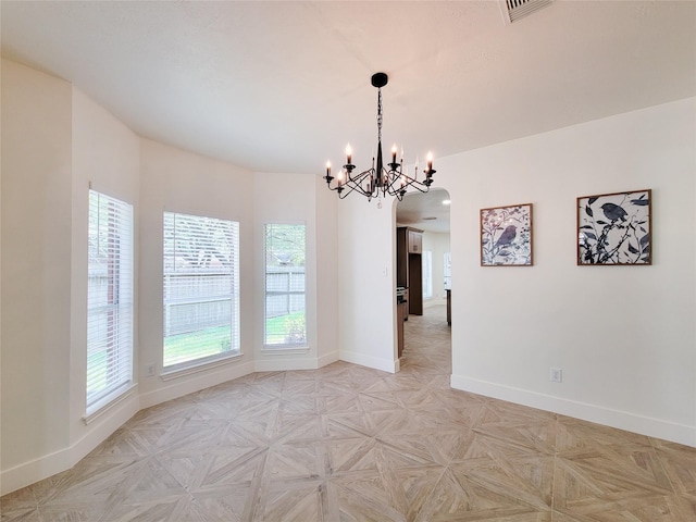 218 Windrift Ct, Sugar Land, TX 77479 - spare room featuring baseboards, a chandelier, and arched walkways