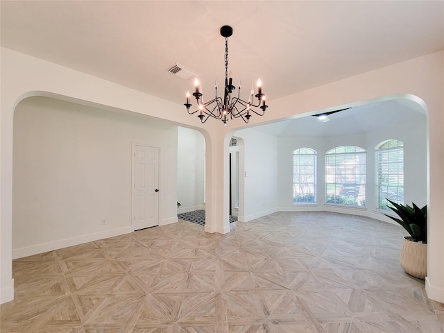 218 Windrift Ct, Sugar Land, TX 77479 - spare room featuring arched walkways, a chandelier, and baseboards