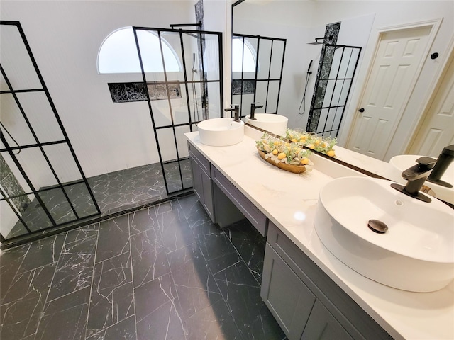 218 Windrift Ct, Sugar Land, TX 77479 - bathroom featuring a walk in shower, marble tiled flooring, and double vanity