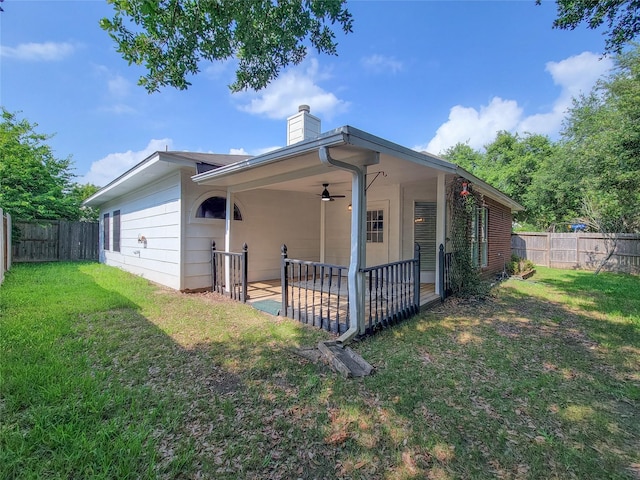218 Windrift Ct, Sugar Land, TX 77479 - back of property featuring a chimney, a ceiling fan, and a patio area