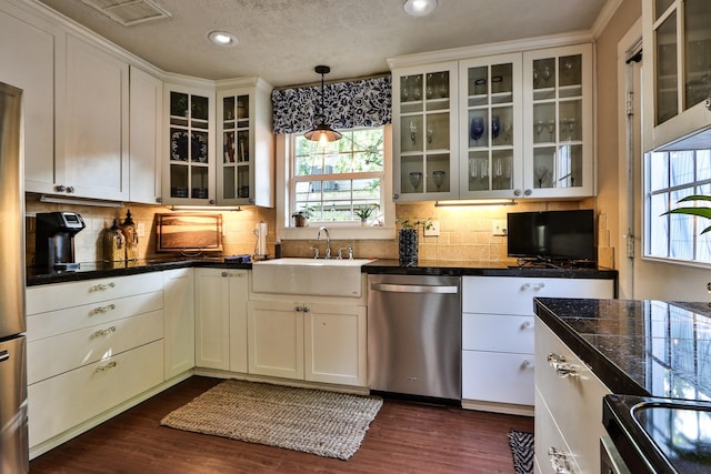 434 Lakeside Dr, Kemah, TX 77565 - kitchen with stainless steel dishwasher, healthy amount of natural light, backsplash, recessed lighting, and a textured ceiling