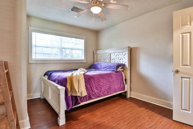 434 Lakeside Dr, Kemah, TX 77565 - bedroom with wood finished floors, a textured ceiling, and ceiling fan