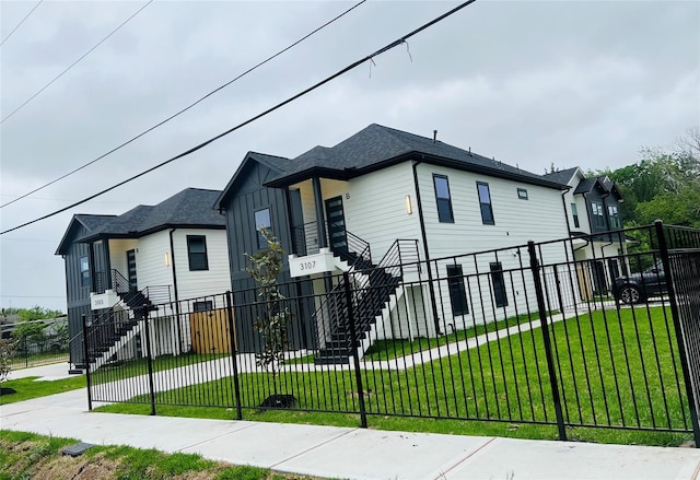 3107 Grassmere St A/B, Unit A/B Houston, TX 77051 - view of front facade featuring stairway and board and batten siding