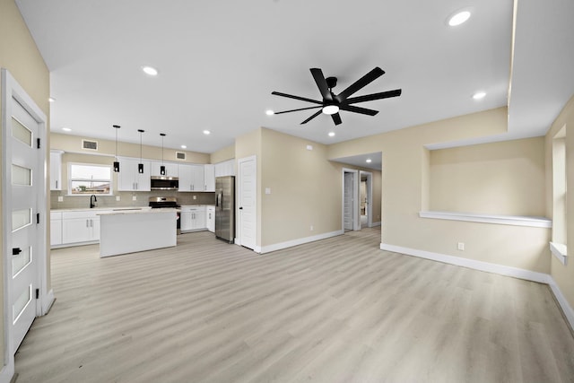 3107 Grassmere St A/B, Unit A/B Houston, TX 77051 - unfurnished living room with a ceiling fan, light wood-type flooring, baseboards, and recessed lighting