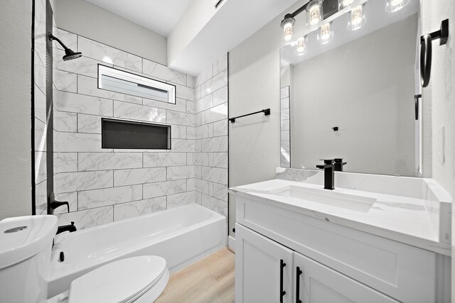 3107 Grassmere St A/B, Unit A/B Houston, TX 77051 - bathroom featuring toilet, vanity, wood finished floors, and washtub / shower combination