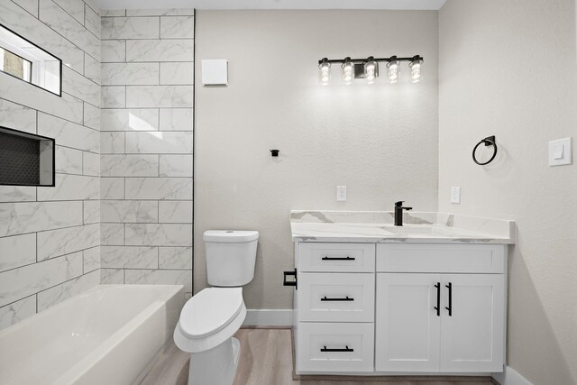 3107 Grassmere St A/B, Unit A/B Houston, TX 77051 - bathroom with vanity, toilet, baseboards, wood finished floors, and bathtub / shower combination