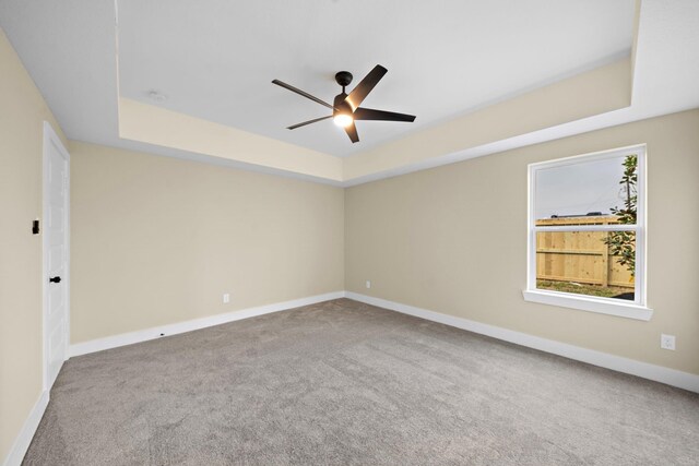 3107 Grassmere St A/B, Unit A/B Houston, TX 77051 - carpeted empty room featuring a raised ceiling, a ceiling fan, and baseboards