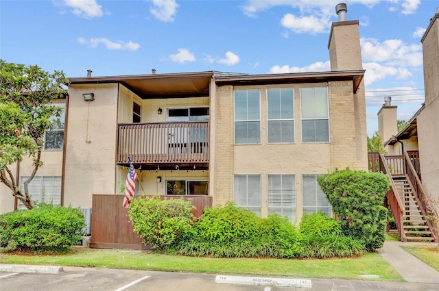 1500 Bay Area Blvd Unit 433, Houston, TX 77058 - view of property with stairway and uncovered parking