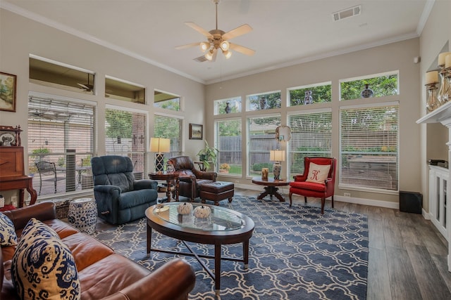 1211 Brinson Ct, Spring, TX 77379 - living room featuring ceiling fan, wood finished floors, crown molding, baseboards, and a fireplace