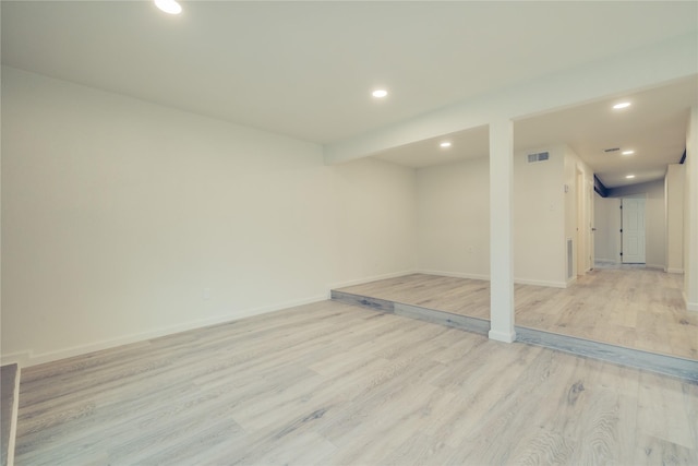 12553 Wellington Park Dr, Houston, TX 77072 - finished basement featuring light wood-style flooring, recessed lighting, and baseboards