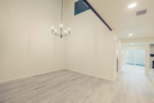 12553 Wellington Park Dr, Houston, TX 77072 - unfurnished dining area with light wood-type flooring, a chandelier, recessed lighting, baseboards, and a fireplace