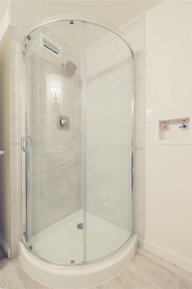 12553 Wellington Park Dr, Houston, TX 77072 - bathroom with a stall shower and baseboards